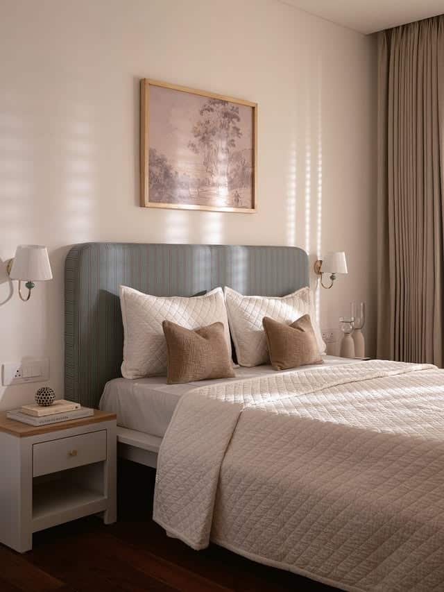 7. Subtle Neutral Bedroom with Textured Headboard Detail - small guest bedroom ideas