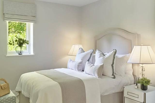 16. Minimal Light Neutral Bedroom with Soft Layering - small guest bedroom ideas