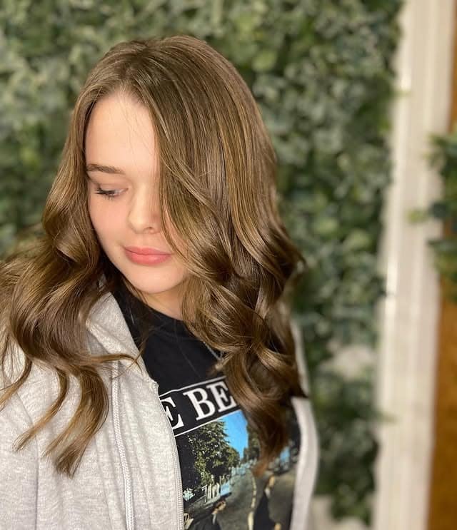 1. Soft Brunette Layered Shag with Face-Framing Waves - Layered Shaggy Hairstyles