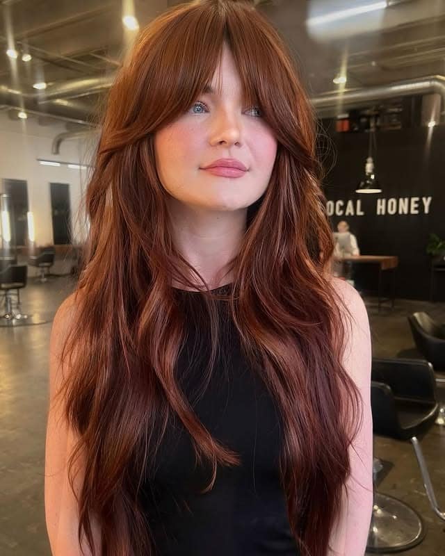 3. Copper Red Long Shag with Wispy Bangs - Layered Shaggy Hairstyles