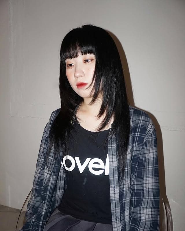 7. Straight Black Shag with Blunt Micro Fringe - Layered Shaggy Hairstyles