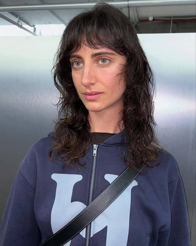 12. Soft Black Curly Shag with Airy Fringe - Layered Shaggy Hairstyles