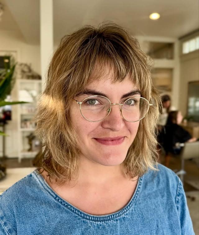 16. Sandy Blonde Layered Shag with Wispy Bangs - Layered Shaggy Hairstyles