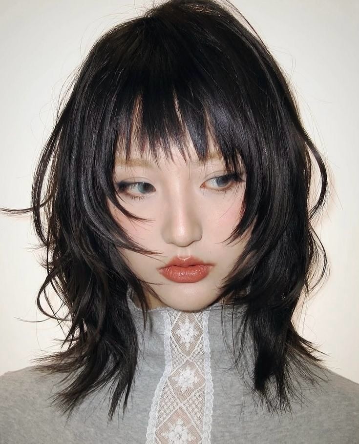 19. Soft Black Wispy Shag Bob with Airy Bangs - Short Shaggy And Wispy Haircuts