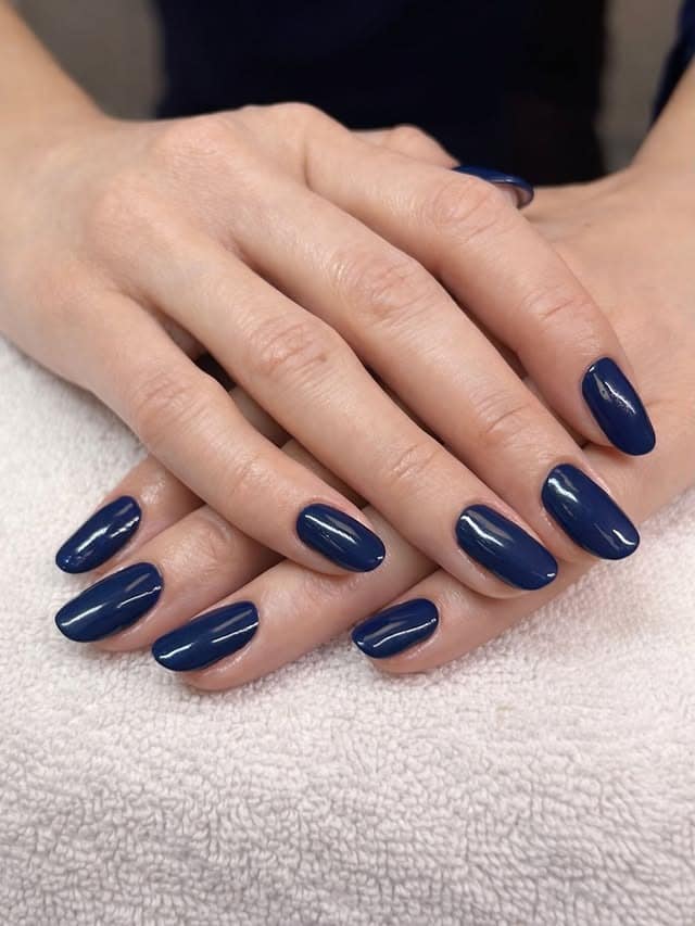 1. Glossy Navy Almond Nails - blue nail ideas