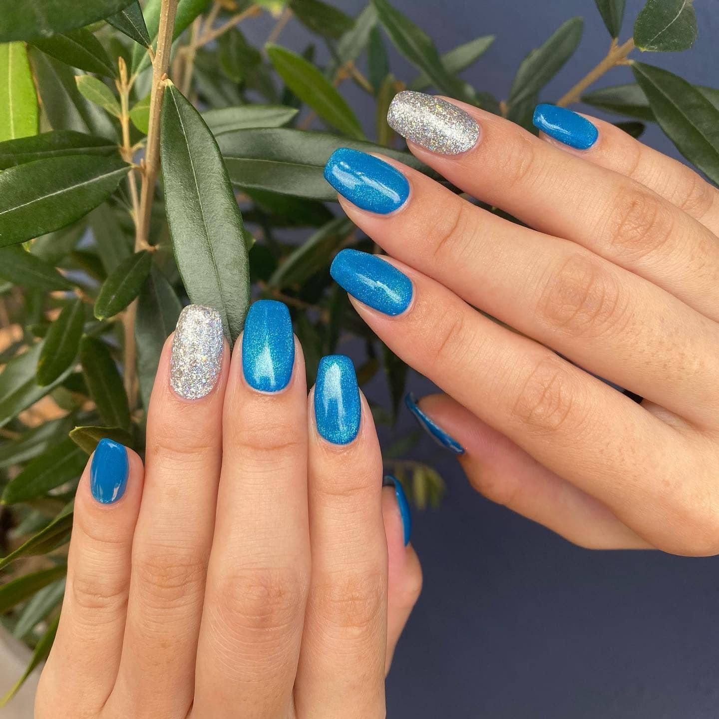 5. Turquoise Blue Glitter Accent Nails - blue nail ideas