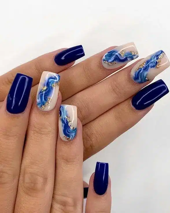 6. Deep Blue Marble Coffin Nails with Gold Foil - blue nail ideas
