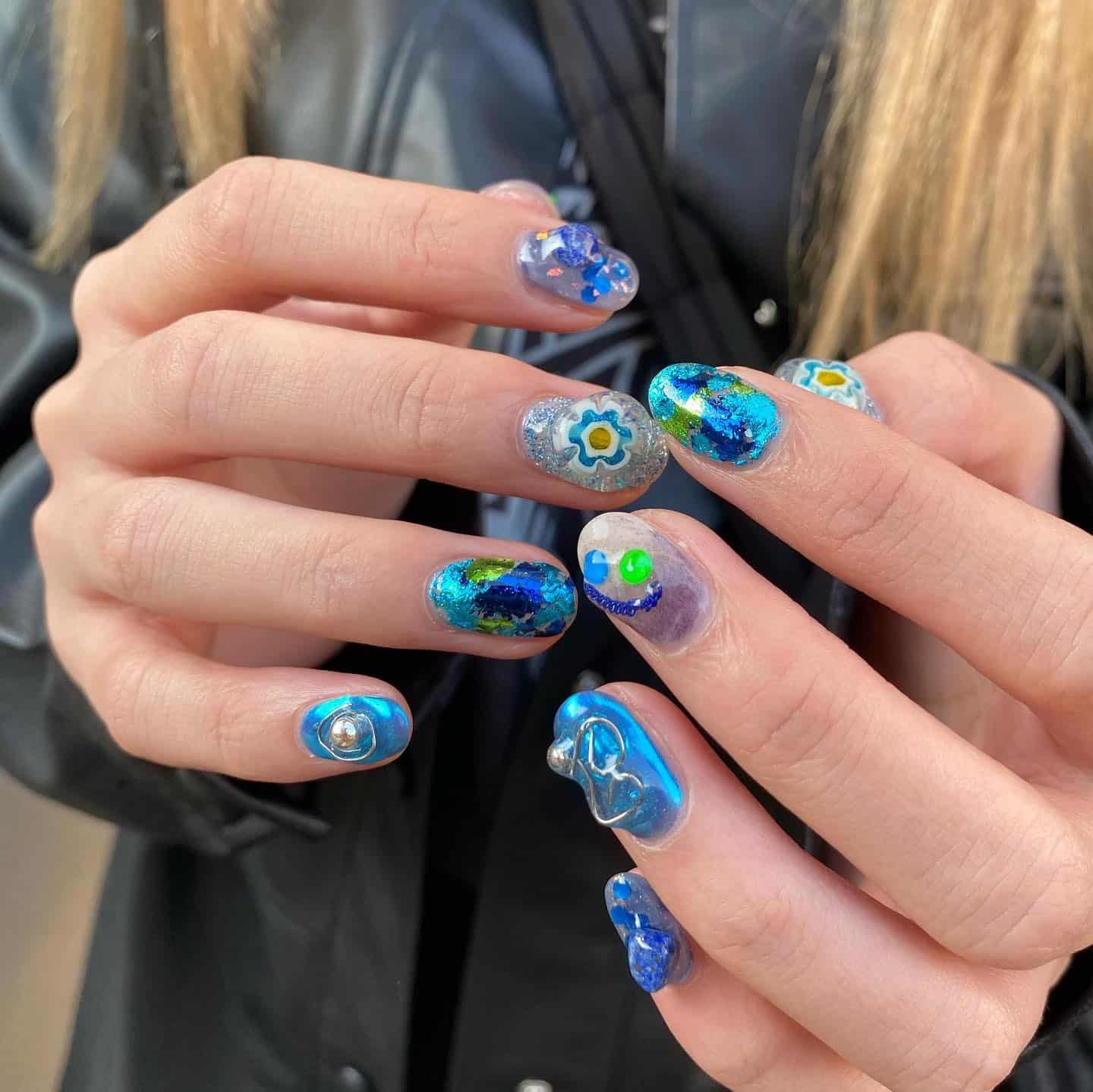 13. Abstract Ocean-Inspired Mixed Art Nails - blue nail ideas
