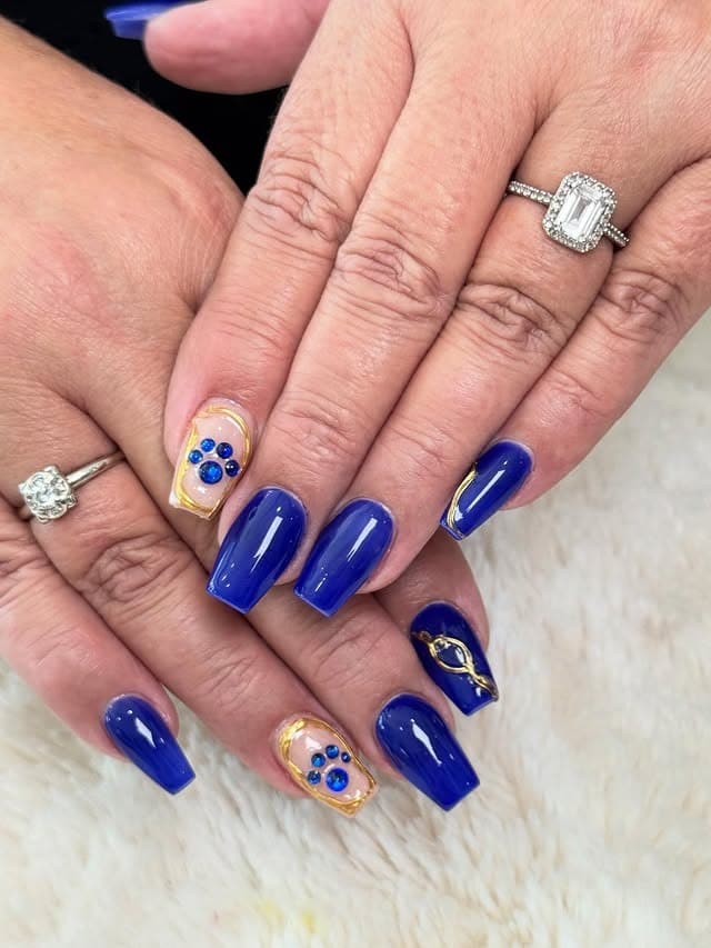 16. Royal Blue Coffin Nails with Gold Frame Accents - blue nail ideas