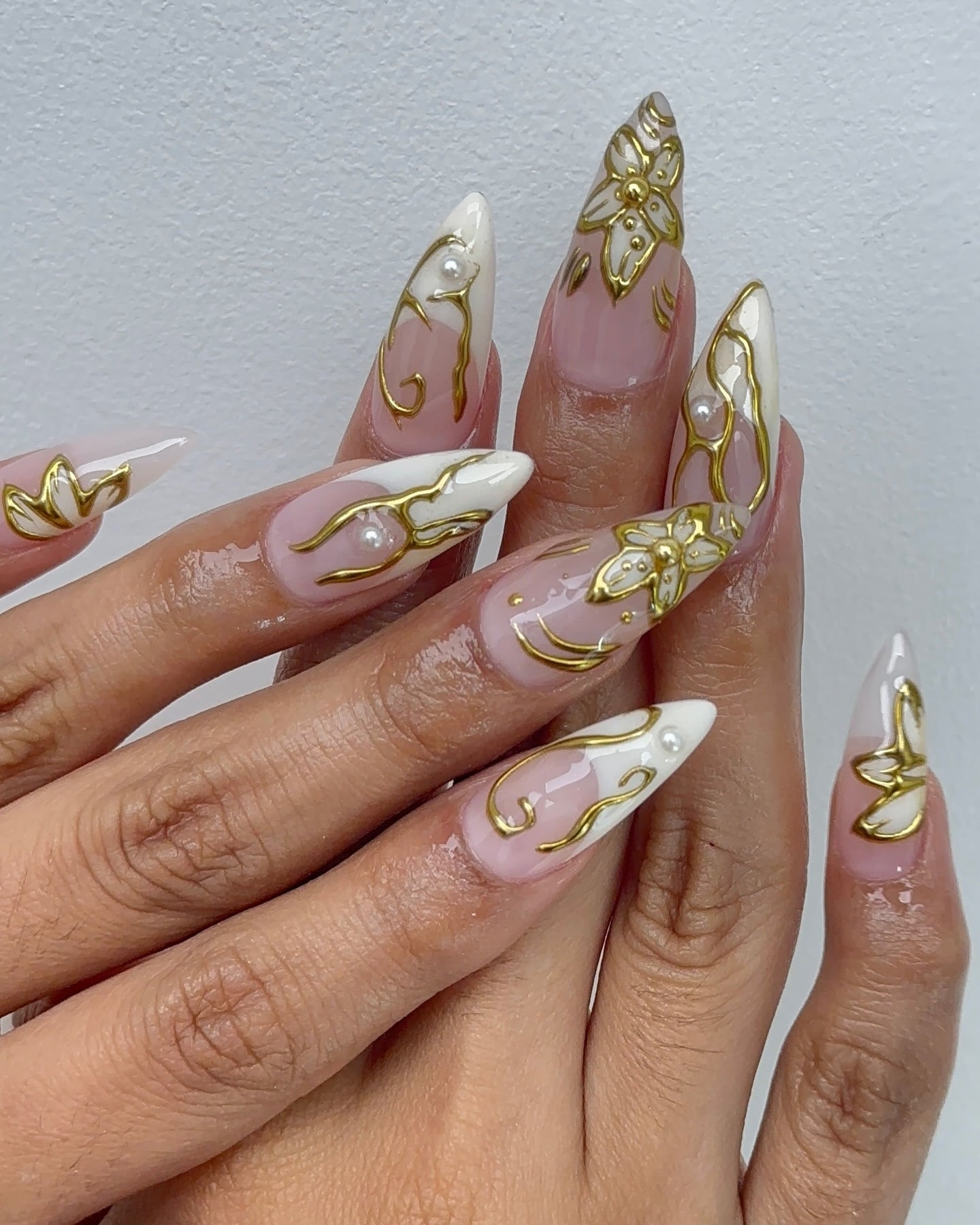3. White French Tip Nails with Gold Floral Accents - nail ideas with gold