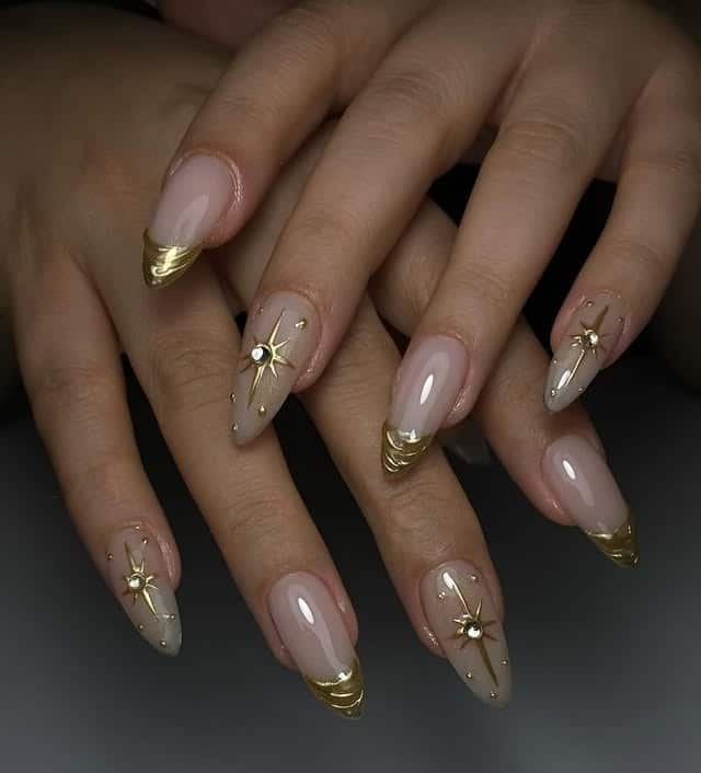 10. Nude Almond Nails with Gold Starburst Accents - nail ideas with gold