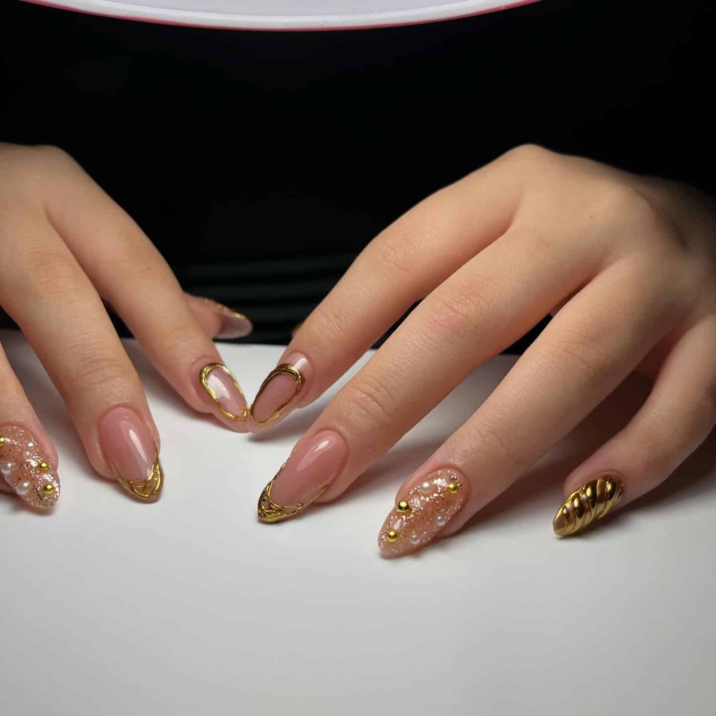 11. Nude Almond Nails with Gold Chrome Accents and Pearl Detail - nail ideas with gold