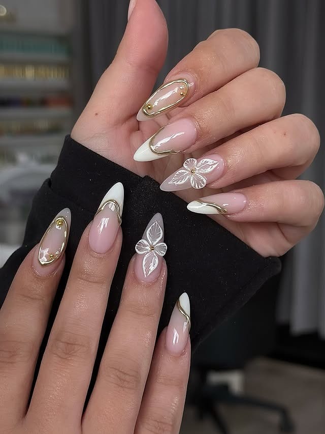 14. White French Stiletto Nails with Gold Outline and Floral Art - nail ideas with gold