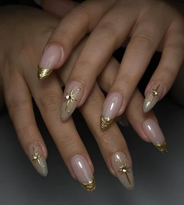 20. Nude Almond Nails with Gold French Tips and Starburst Accents - nail ideas with gold