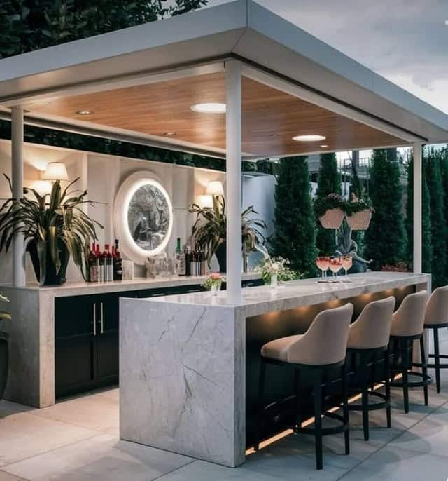 2. Contemporary Covered Bar Kitchen in Soft Neutrals and Marble Finish - outdoor kitchen ideas