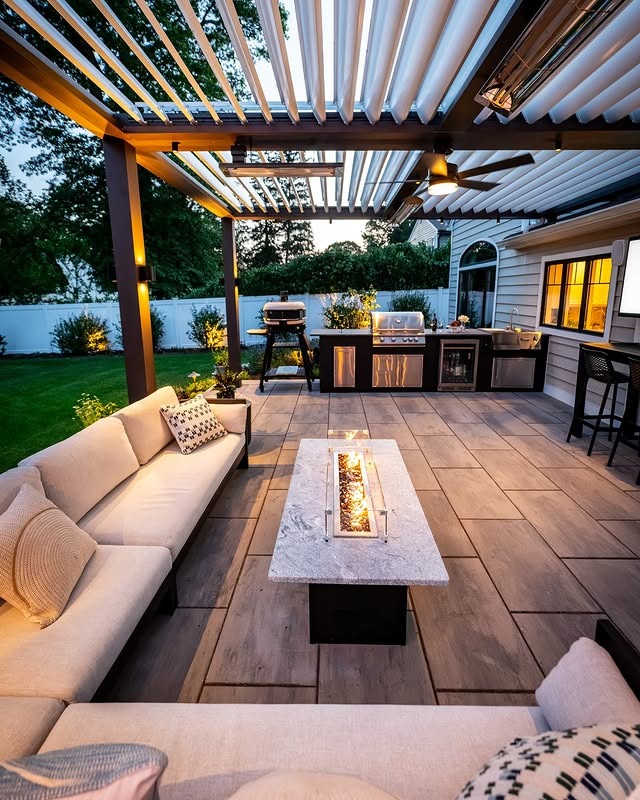 5. Cozy Outdoor Lounge Kitchen with Neutral Palette and Fire Feature - outdoor kitchen ideas