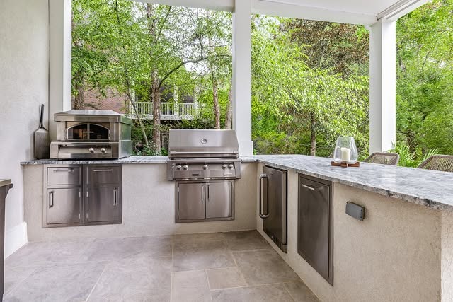 8. Minimalist Outdoor Kitchen with Stainless Steel and Light Stone Finishes - outdoor kitchen ideas