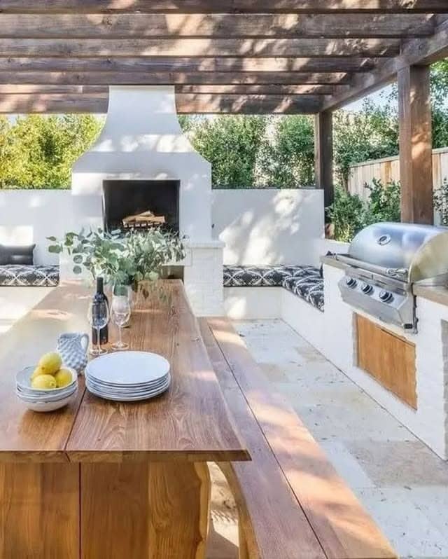 9. Rustic Alfresco Kitchen with Timber Beams and Soft White Plaster - outdoor kitchen ideas