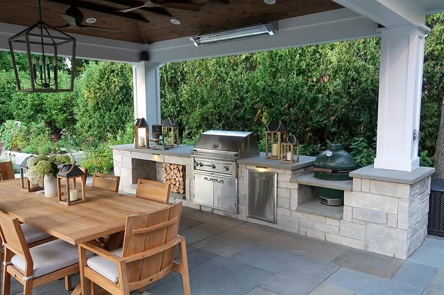 20. Traditional Outdoor Dining Kitchen with Soft Stone and Warm Wood Elements - outdoor kitchen ideas