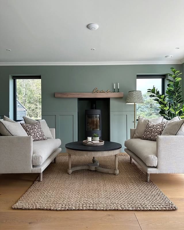 14. Dusty Sage Green Living Room with Balanced Symmetry - green living room ideas
