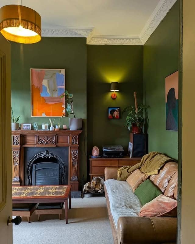 16. Dark Moss Green Living Room with Warm Vintage Touches - green living room ideas