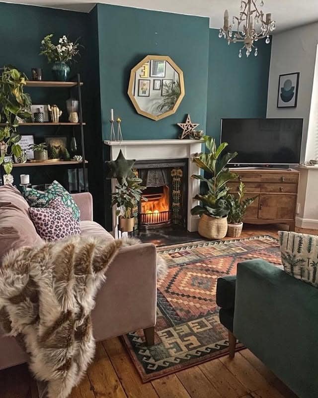 18. Teal Green Living Room with Cozy Layered Styling - green living room ideas