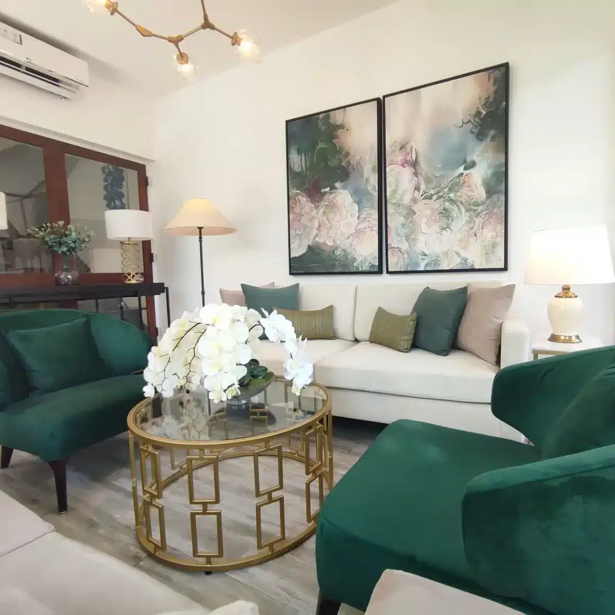 22. Emerald Green and Cream Living Room with Polished Glam Accents - green living room ideas