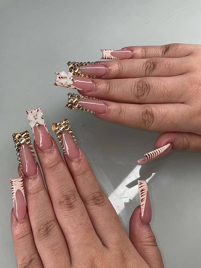 3. Nude Coffin Nails with Gold Embellished Frames - bling nail ideas