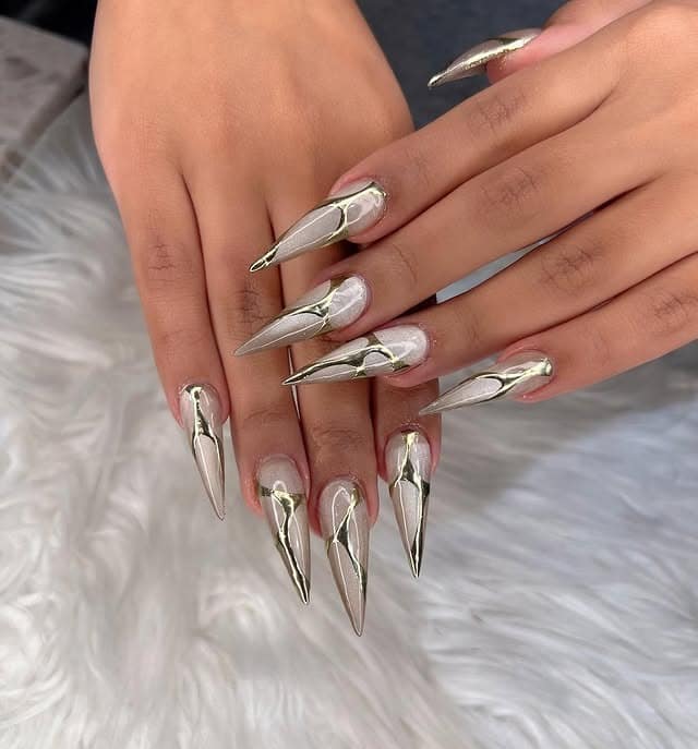 7. Silver Chrome Stiletto Nails with Abstract Lines - bling nail ideas