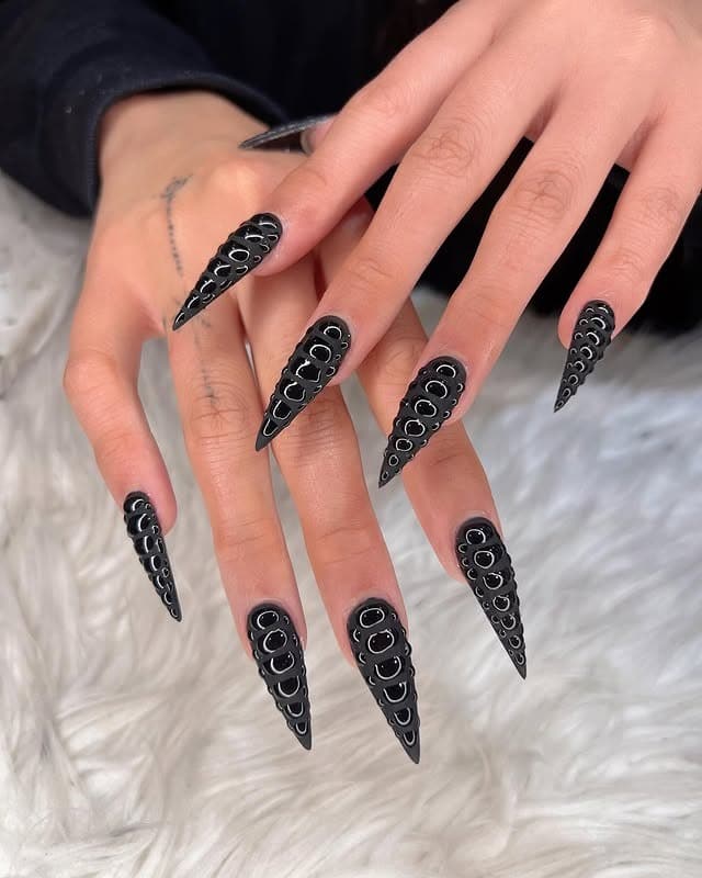18. Matte Black Stiletto Nails with 3D Bubble Texture - bling nail ideas