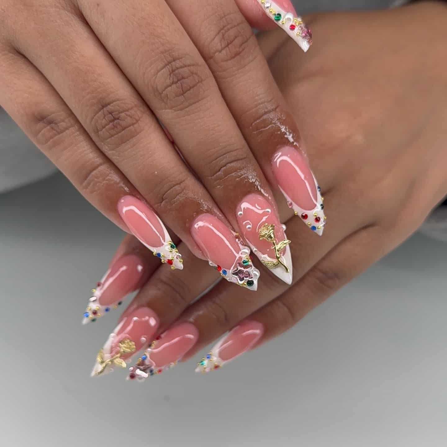 19. Blush Pink Almond Nails with Multicolor Rhinestone French Tips - bling nail ideas