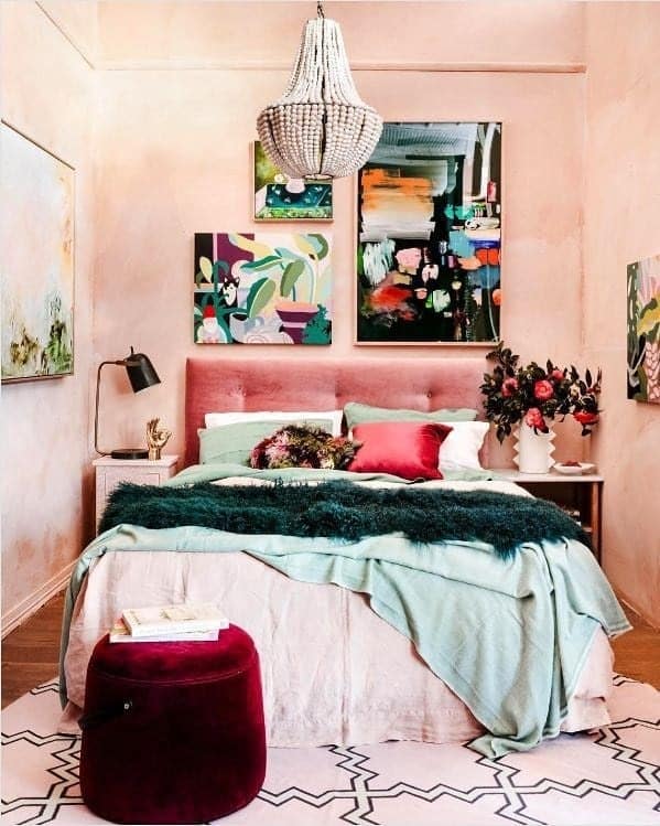 15. Soft Pink Bedroom with Jewel-Toned Layering - eclectic bedroom ideas