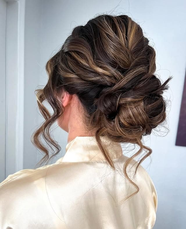 4. Textured Low Bun with Face-Framing Pieces in Dimensional Brunette - Boho Hairstyles