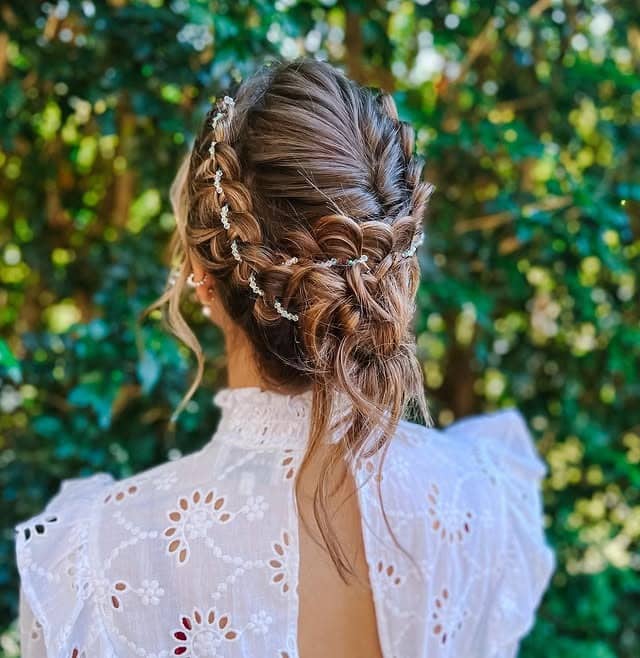 12. Braided Garden Updo in Soft Brown with Delicate Accents - Boho Hairstyles