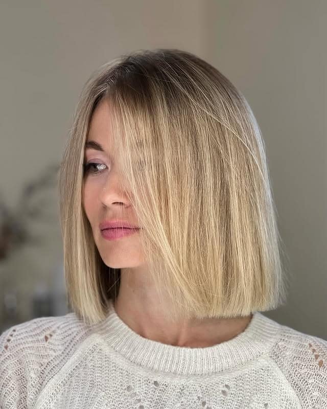 4. Creamy Blonde Blunt Bob with Side Sweep - Blunt Cut Bob
