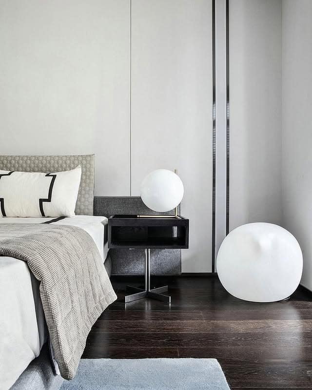 19. Minimal Black and White Bedroom with Sculptural Lighting - black, white and grey bedroom ideas
