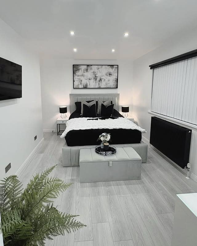 20. Compact Black and White Bedroom with Clean Lines - black, white and grey bedroom ideas
