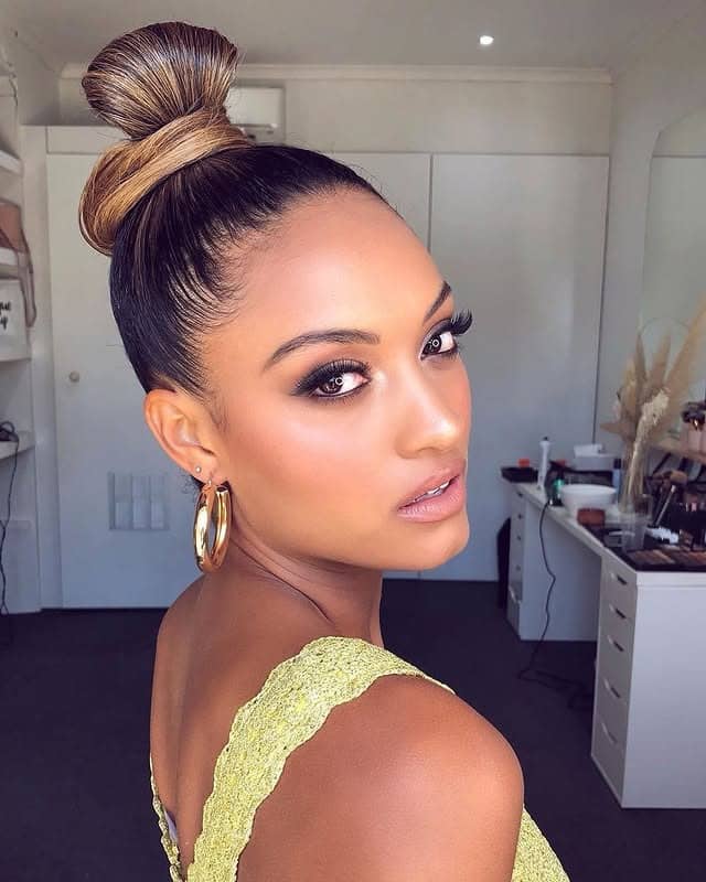 3. Sleek Brunette Sculpted Top Knot - Top Knot Hairstyles