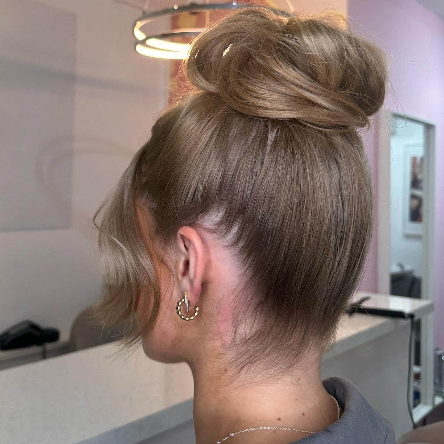 9. Dimensional Brunette Textured Bun Knot - Top Knot Hairstyles