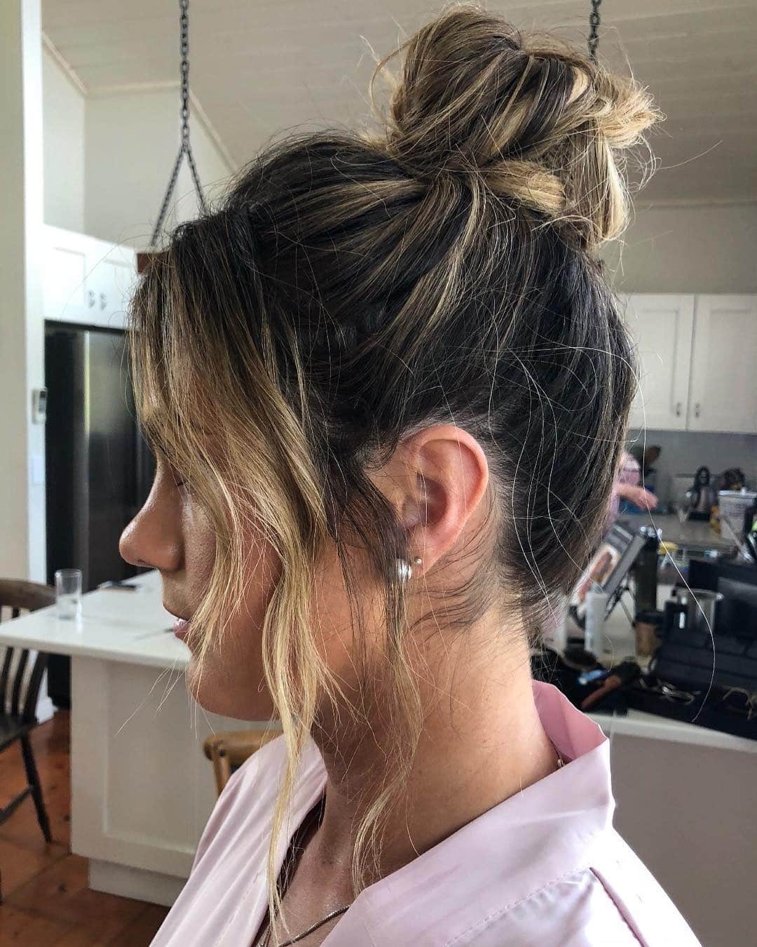 13. Dimensional Brunette Loose Knot with Blonde Ribbons - Top Knot Hairstyles