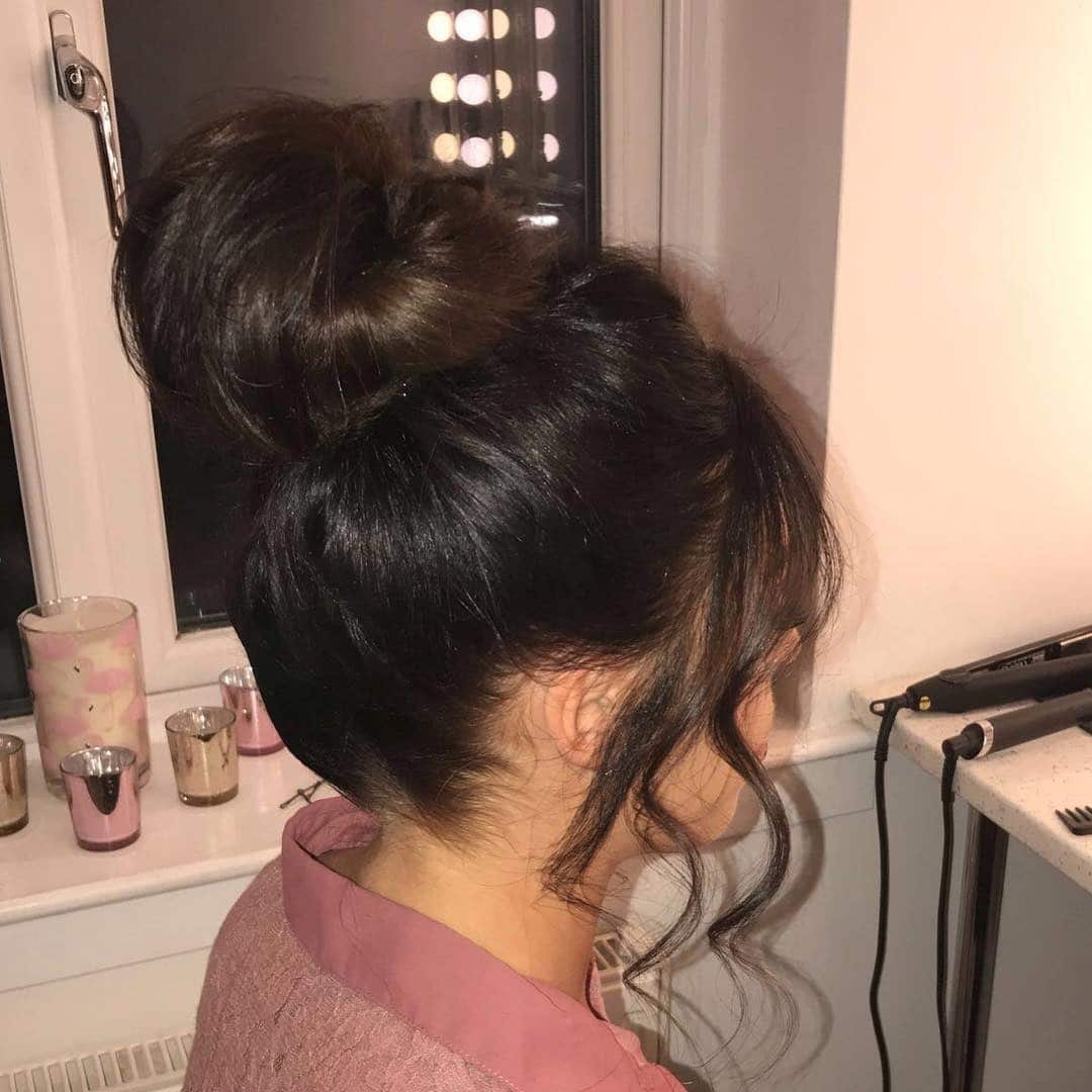 15. Glossy Jet Black Classic High Top Knot - Top Knot Hairstyles