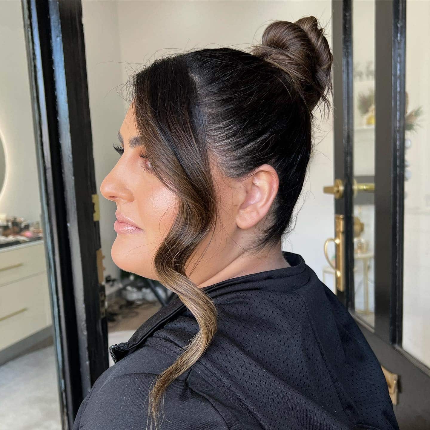 22. Sleek Espresso High Top Knot with Face-Framing Wave - Top Knot Hairstyles