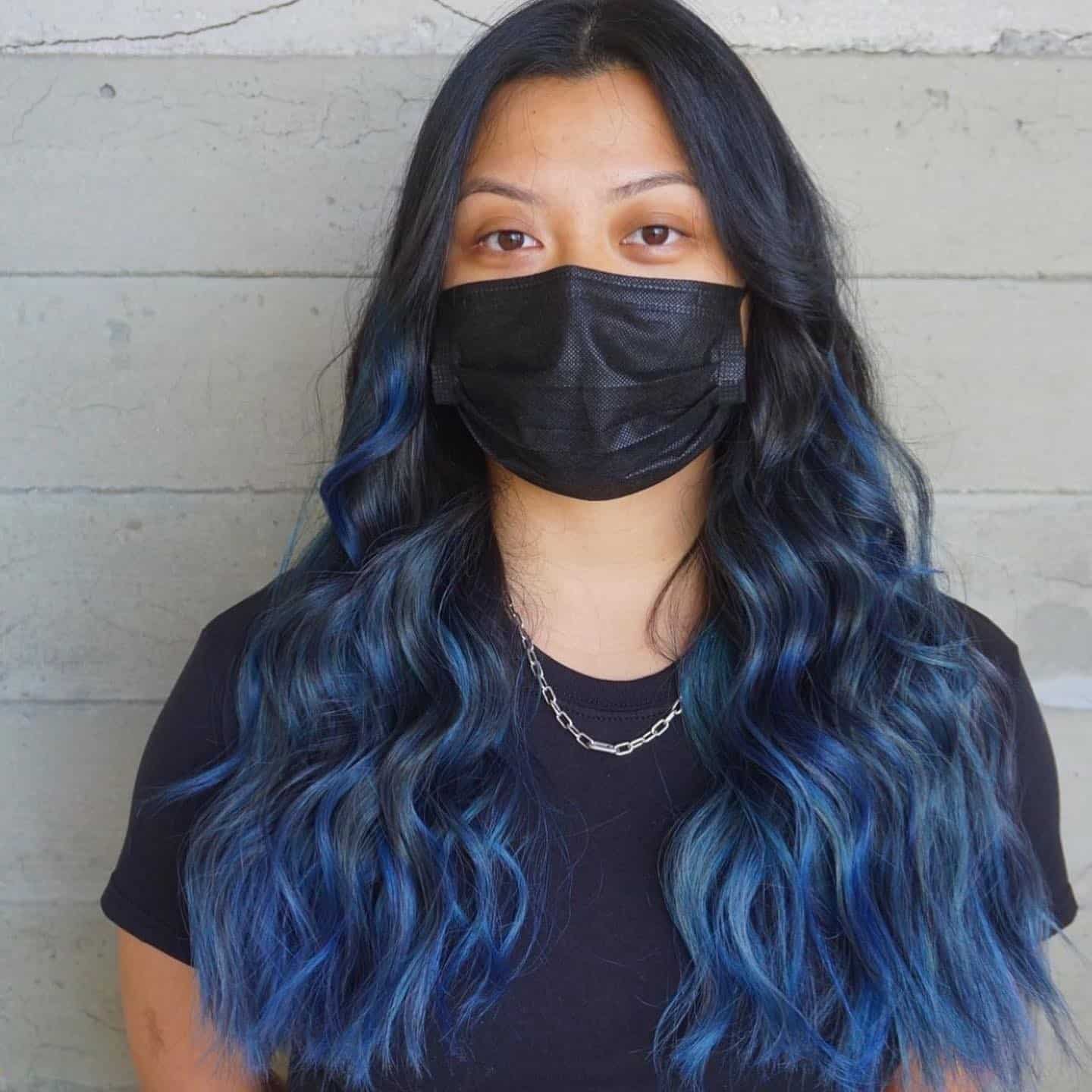 9. Blue-Black Face-Framing Waves - Smoky Blue Hair Color