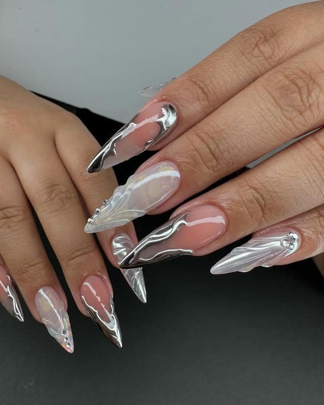 4. Chrome Silver and Sheer Sculpted Stiletto Nails - homecoming nail ideas