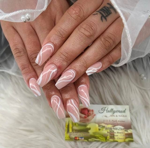 5. Glossy Nude Swirl Almond Nails in Milky Pink - homecoming nail ideas