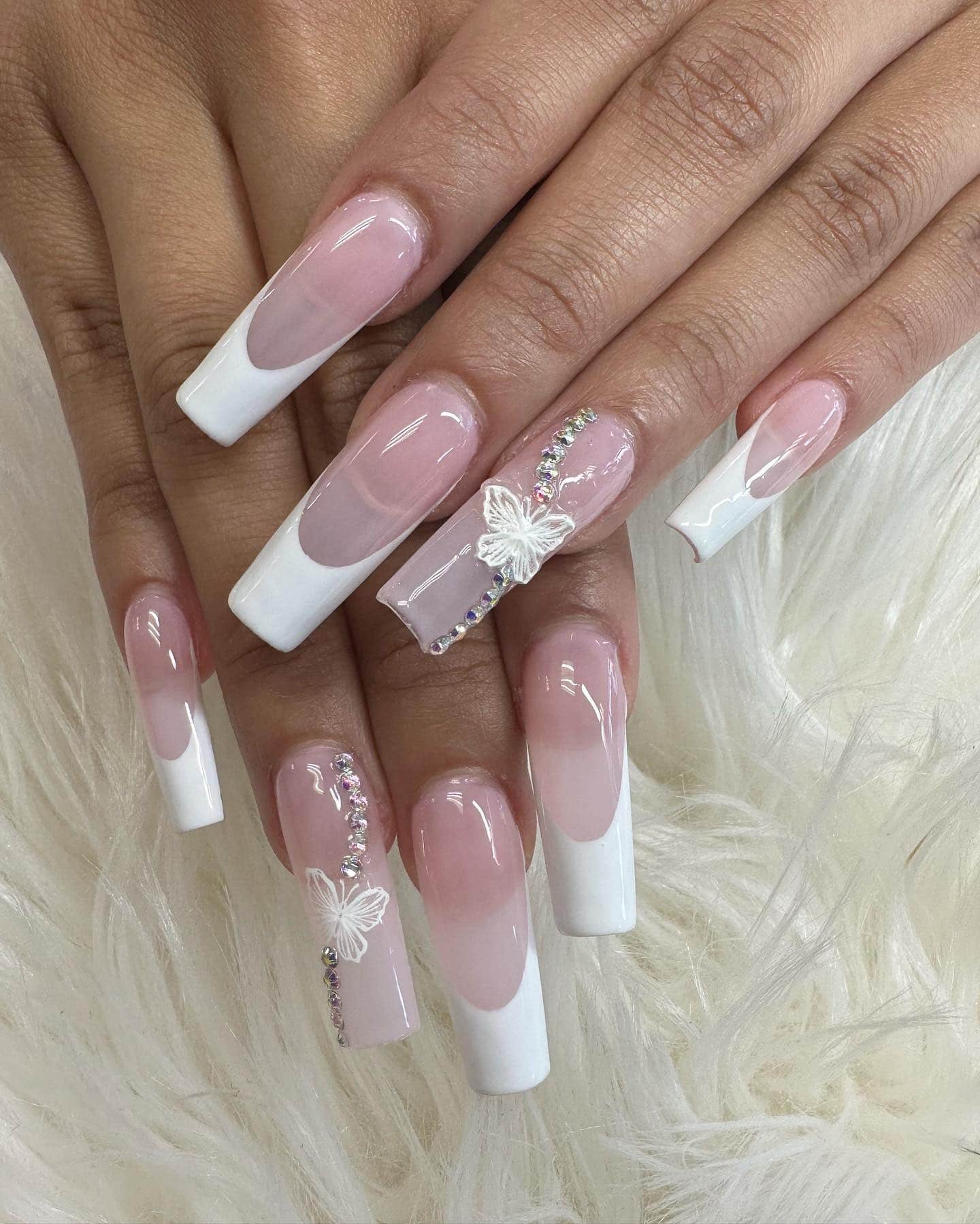 8. Classic White French Tip Coffin Nails with Butterfly Accent - homecoming nail ideas