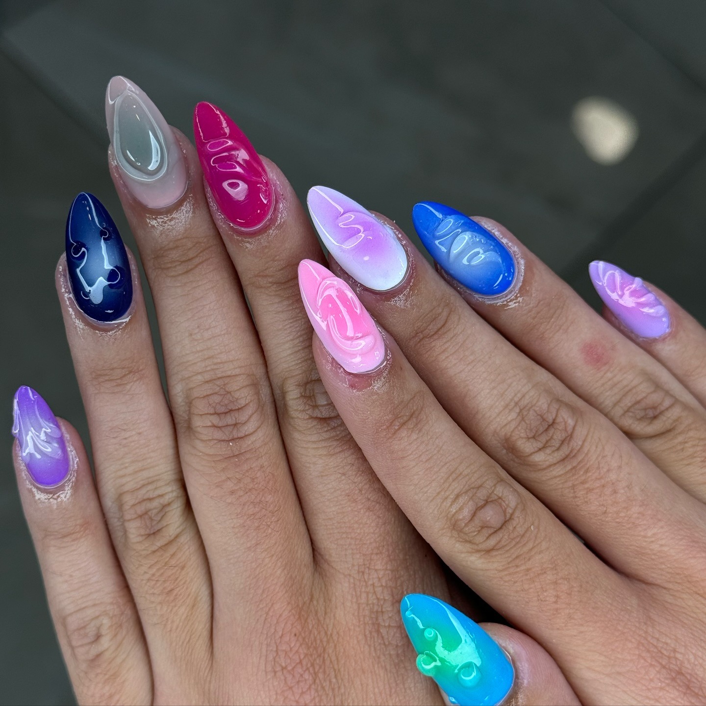 16. Multicolor Aura Almond Nails with Gloss Finish - homecoming nail ideas