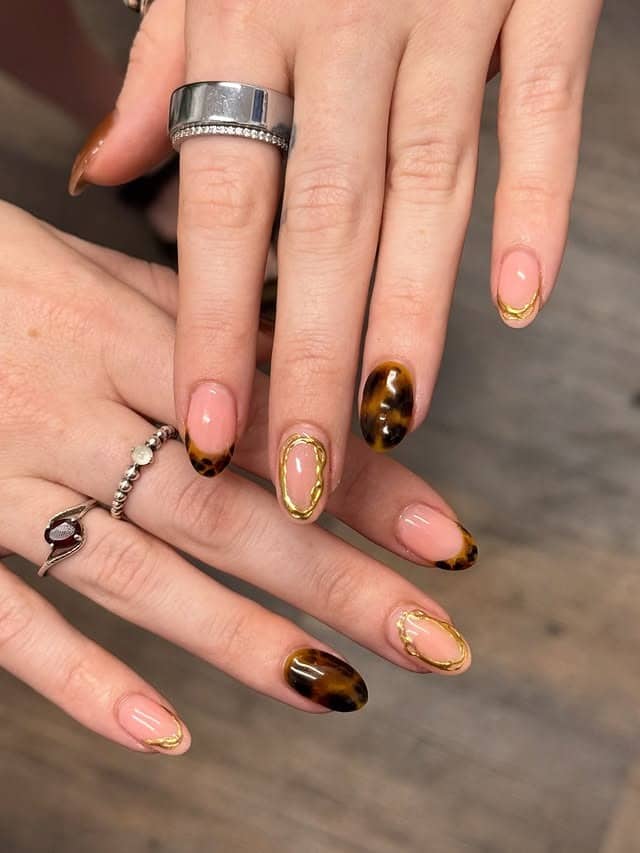 1. Tortoiseshell French with Gold Detailing - fall nail ideas