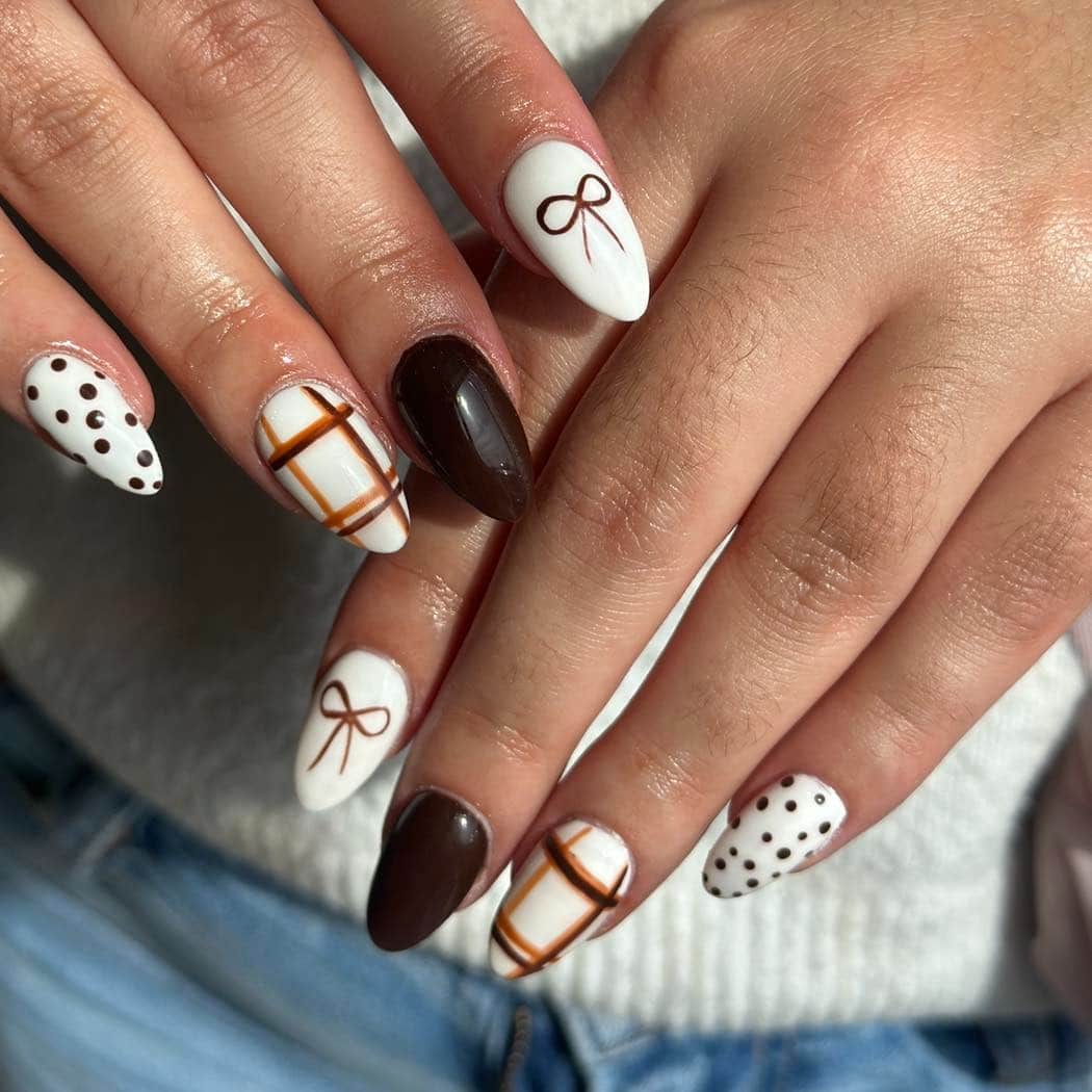 12. Chocolate Brown and White Pattern Mix Almond Nails - fall nail ideas
