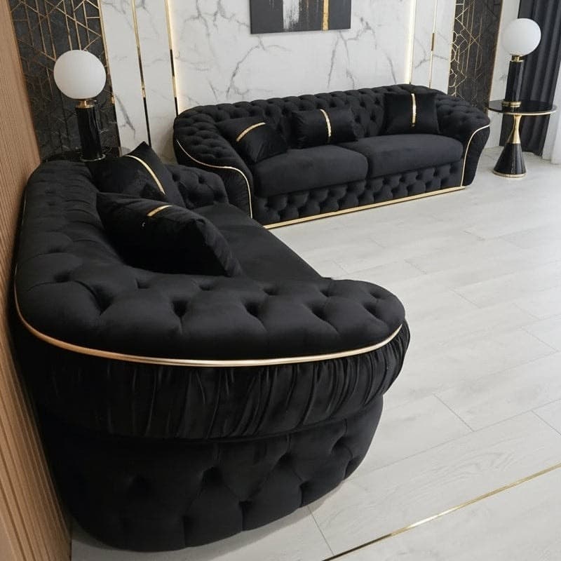 1. Glam Black Tufted Sofa with Gold Accents - black sofa living room ideas